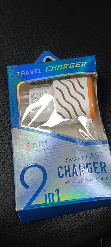 شارژر دیواری دو پورت USB مدل Travel Charger 2 in 1 همراه کابل شارژ