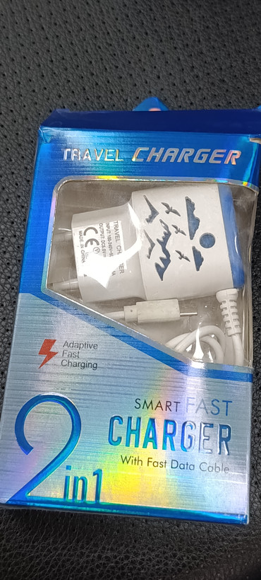 شارژر دیواری دو پورت USB مدل Travel Charger 2 in 1 همراه کابل شارژ