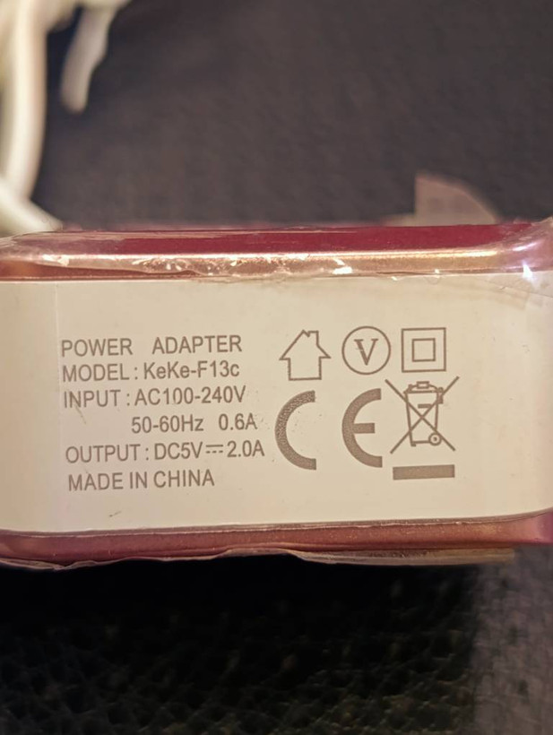 شارژر دیواری KeKe مدل F13C با دو پورت USB و کابل متصل Micro USB خروجی ۵ ولت ۲ آمپر